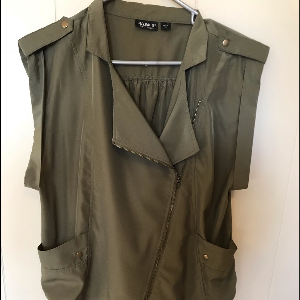 Green zip up top or jacket.